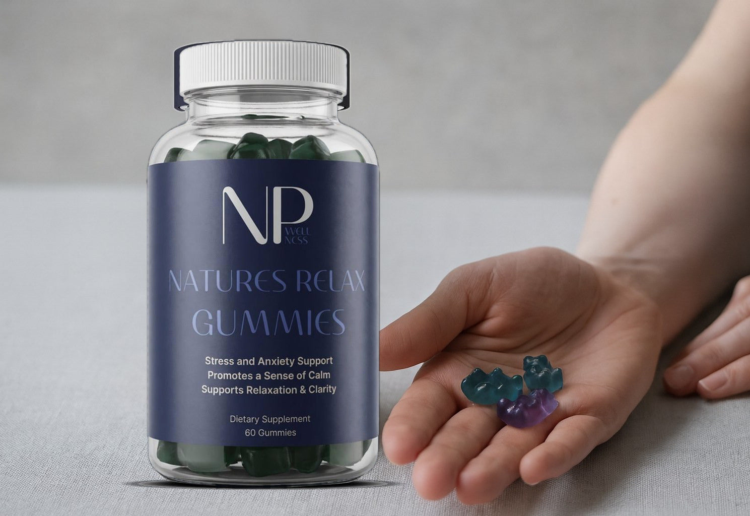 Two Natures Relax gummies held in an open palm beside the bottle